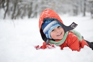 Little boy having fun in the snow