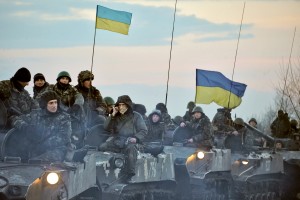 SLOVYANSK, UKRAINE - APRIL14: Ukrainian troops ride tanks on the way toward Slovyanks on April 14, 2014 in Ukraine. Tension has been rising in Ukraine, with pro-Russian activists occupying buildings in more eastern towns and a Russian fighter jet making passes over a U.S. warship in the Black Sea. (Photo by Ilia Pitalev Kommersant Photo via Getty Images)